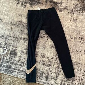 Women Nike legging large with gold Nike symbol, long legging black